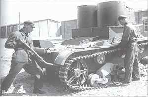 A technical service is being given to the double-turreted T-26