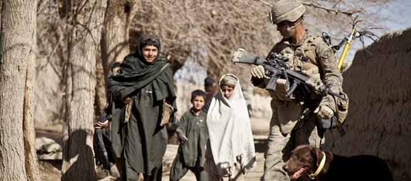 U.S. Marine Corps Lance Cpl. Ricardo Corona, of 3rd Battalion, 7th Marine Regiment, Regimental Combat Team 6, talks with Afghan children during a security patrol Feb. 7, 2012, in Sangin, Afghanistan. (Lance Cpl. Bobby J. Gonzalez)
